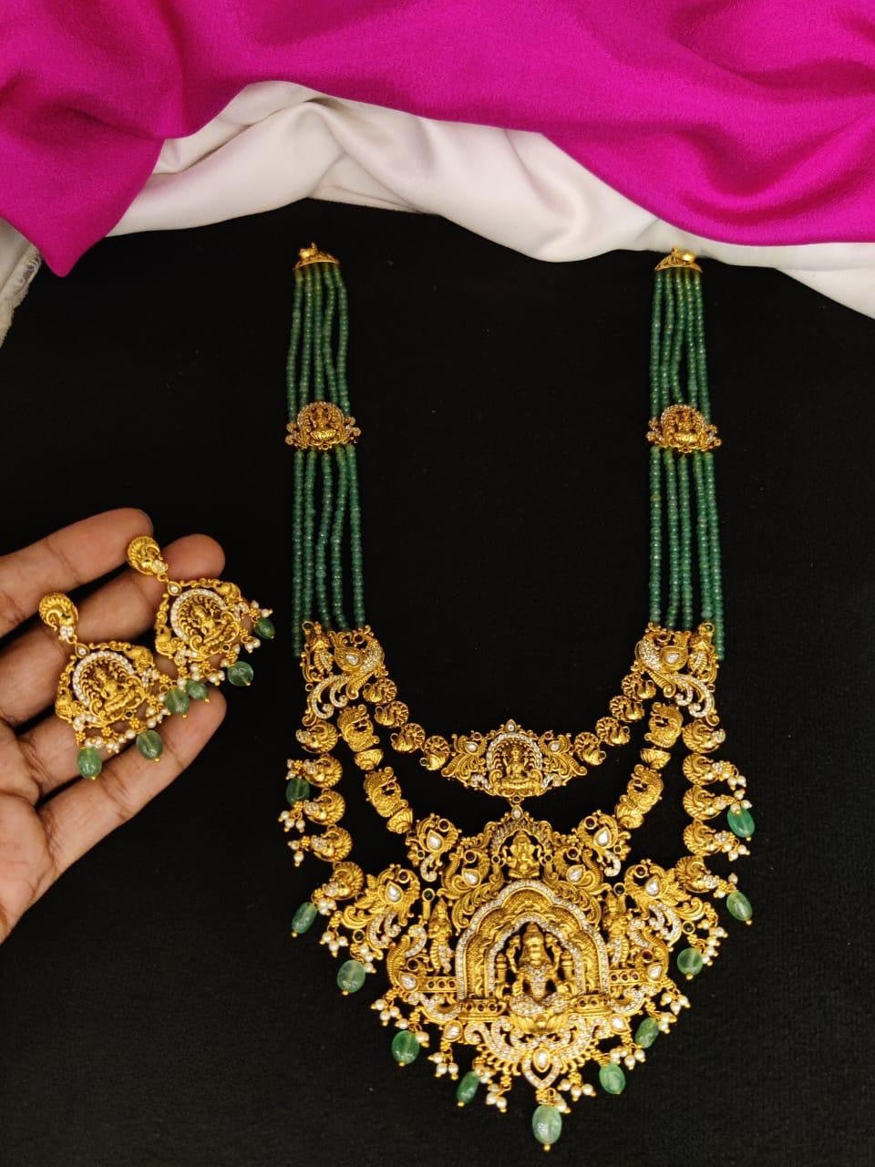 Green crystal beads with heavy pendant .