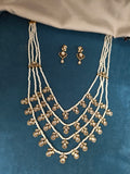 Pearl Mala in 4 layers with mossionite kundan Hangings.